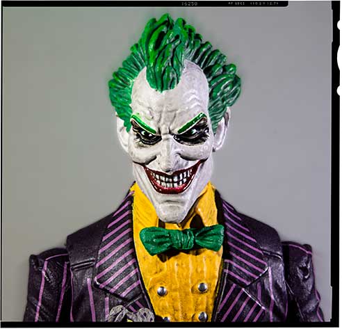 Joker with green hair and purple suit