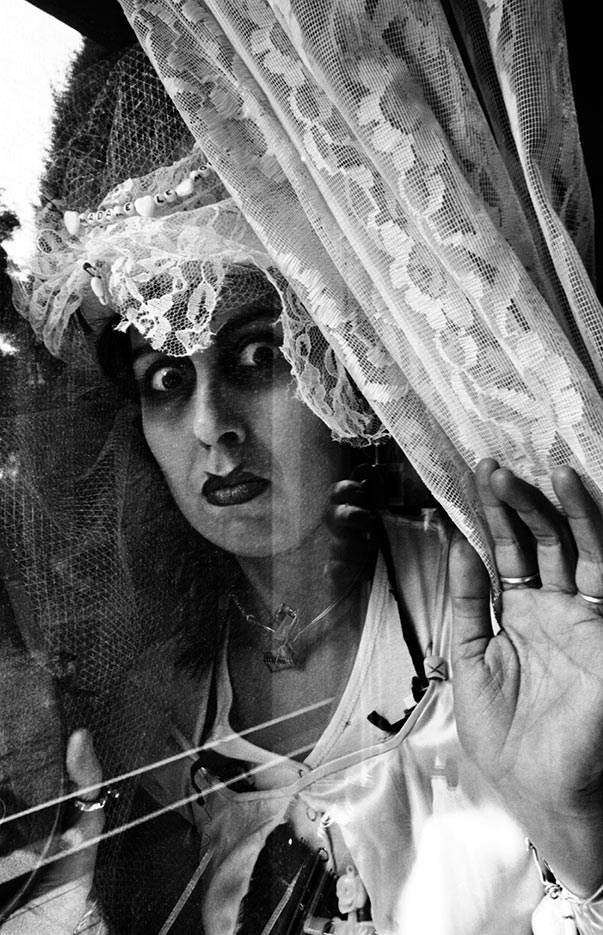 Thelma Heavilin Sanchez as Madam LeMorte at the window