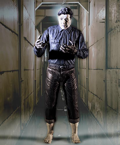 Wolfman Lon Chaney looks at his hands