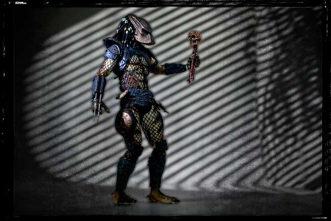 Predator hunter with human skull and spine